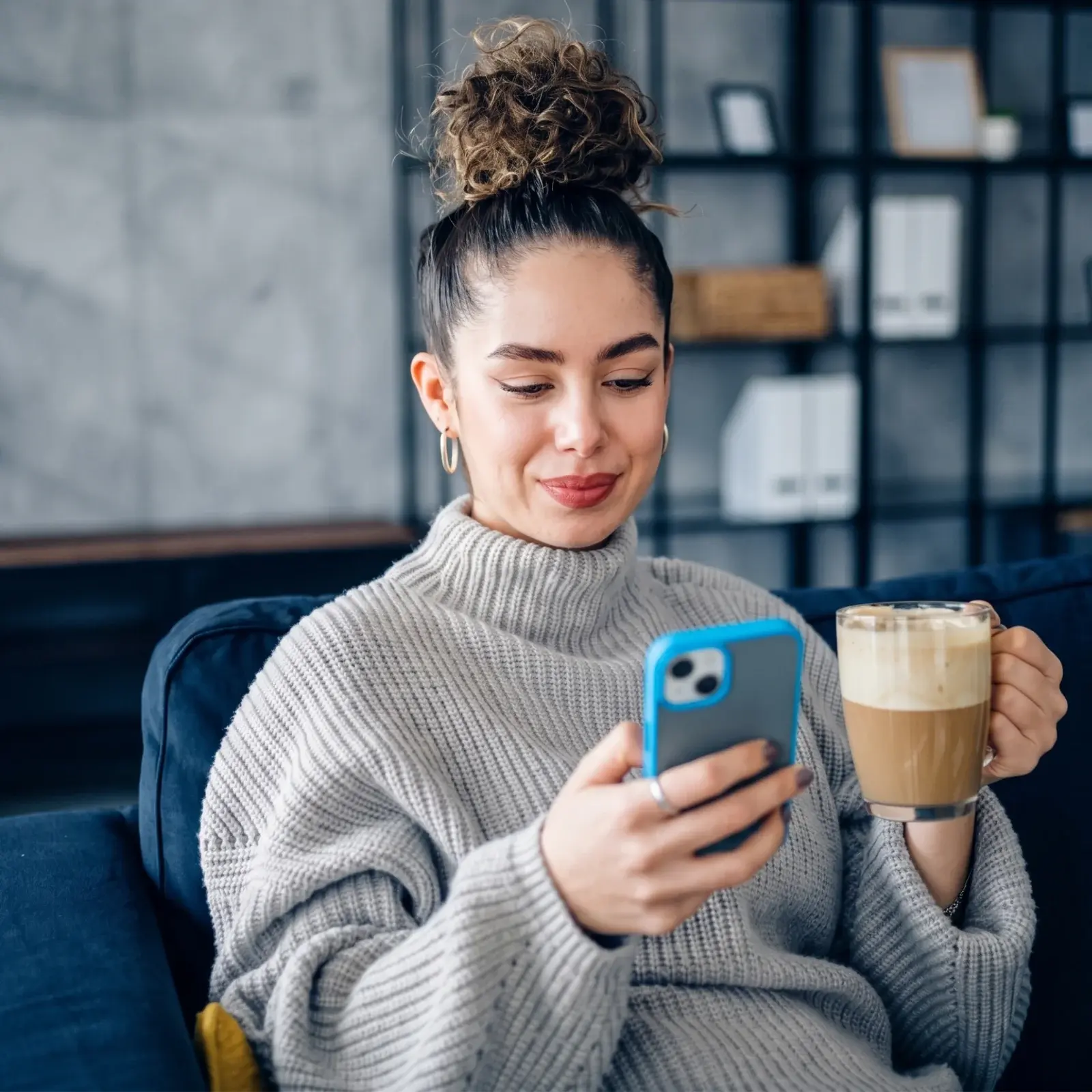 Patient reviewing a document on her phone at home