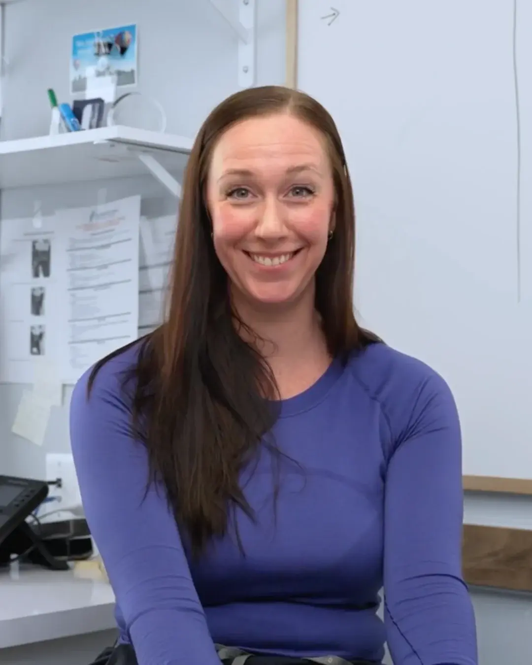 Nikki McKenzie, medical office administrator, at her clinic workstation